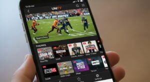 UNITV app interface showing live TV channels on a smartphone